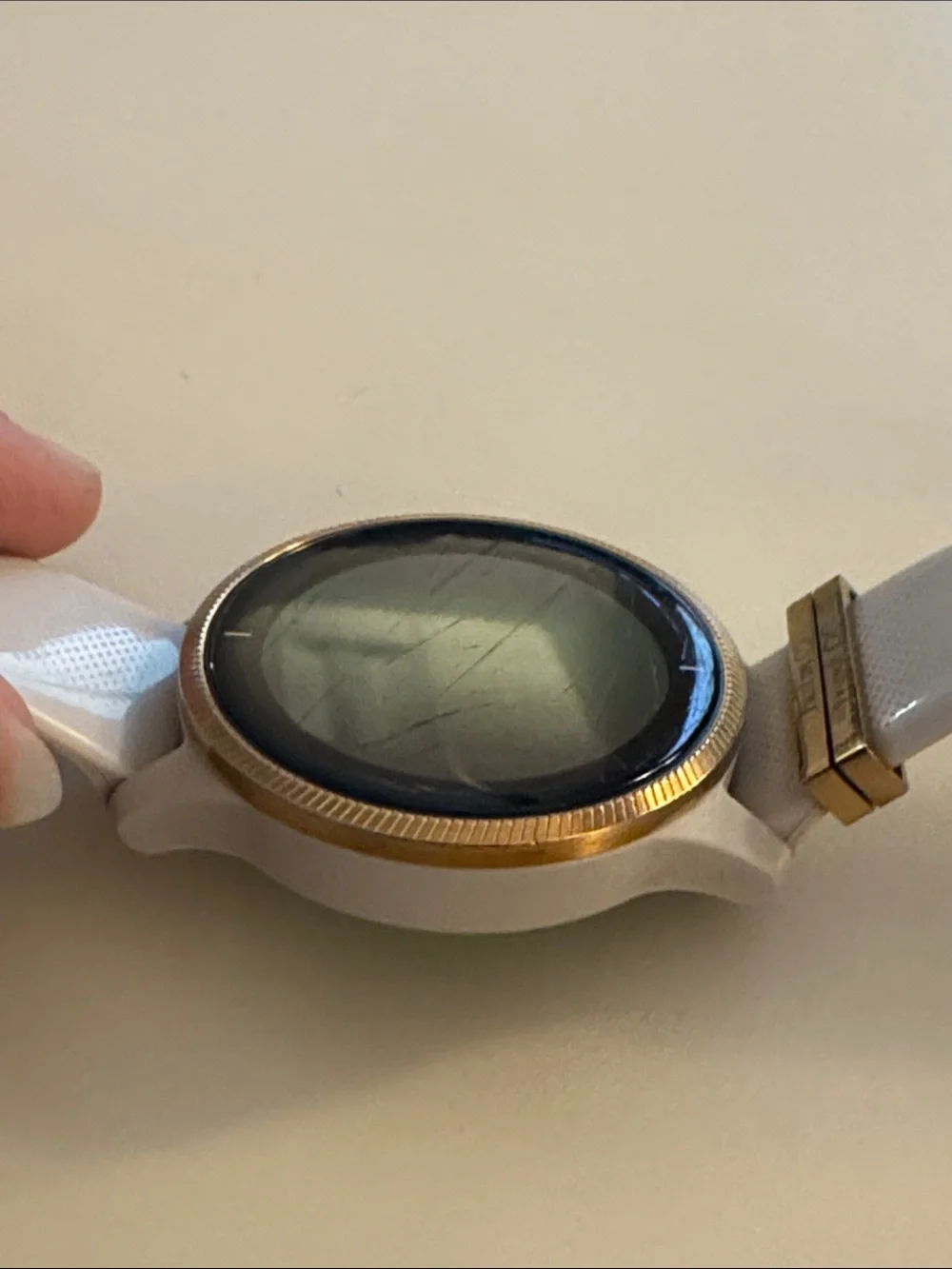 Garmin Venu Smartwatch with tan/cream Strap and rose gold Bezel